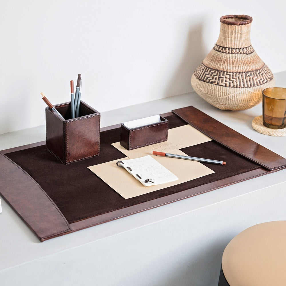 Office desk set in dark brown leather, combining a stylish pen pot, business card holder and leather desk blotter. Personalise for a thoughtful gift to celebrate Father’s Day or a special birthday.