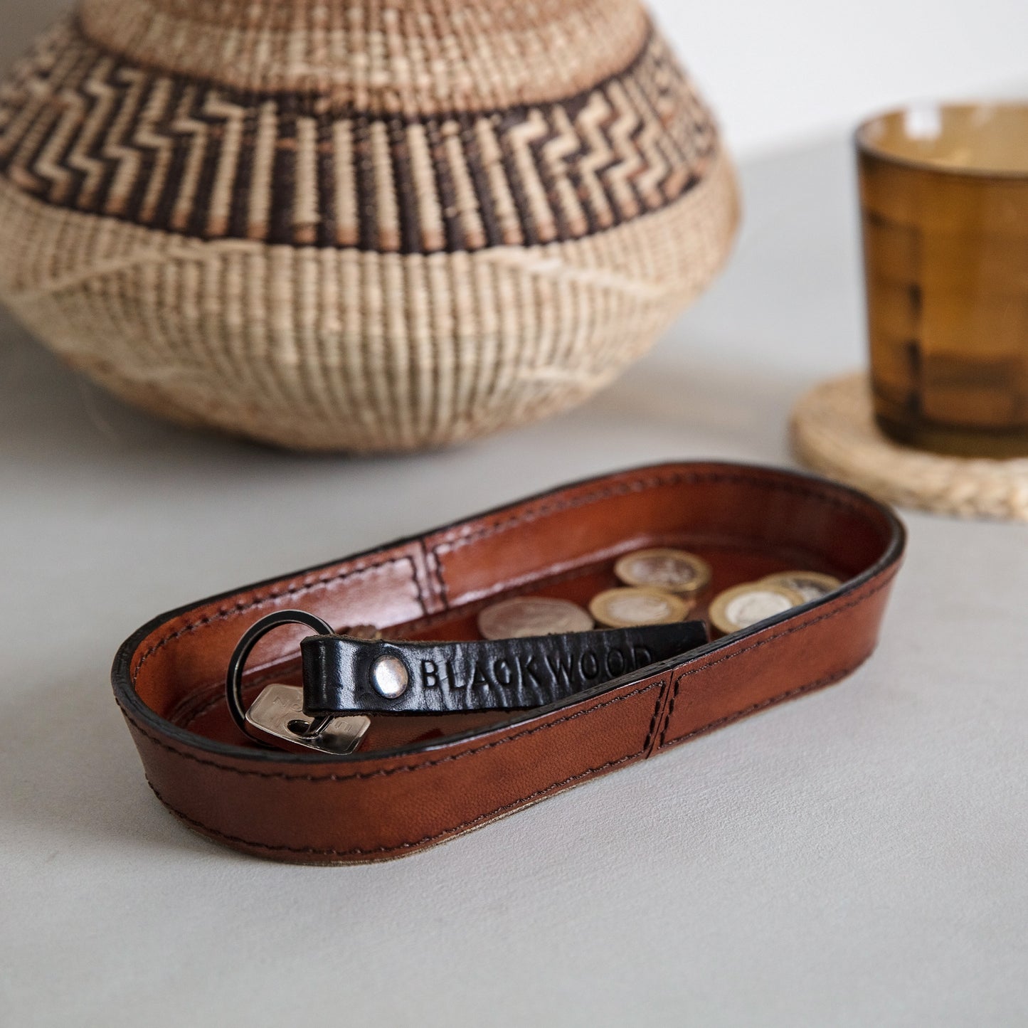 Leather tray for keys and loose change to use in the hallway or on the desk to keep spaces looking tidy. Handmade in tan leather and part of a collection of stylish desk and home accessories, that make thoughtful gifts for Father’s Day or a new home.