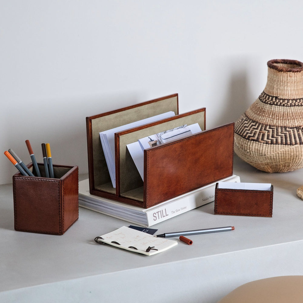 Combining a leather letter rack, pen pot and business card holder, this desk accessories set is both stylish and practical, helping keep small spaces clutter free. Personalise for a thoughtful and unique gift to celebrate a new job or as a gift for the home.