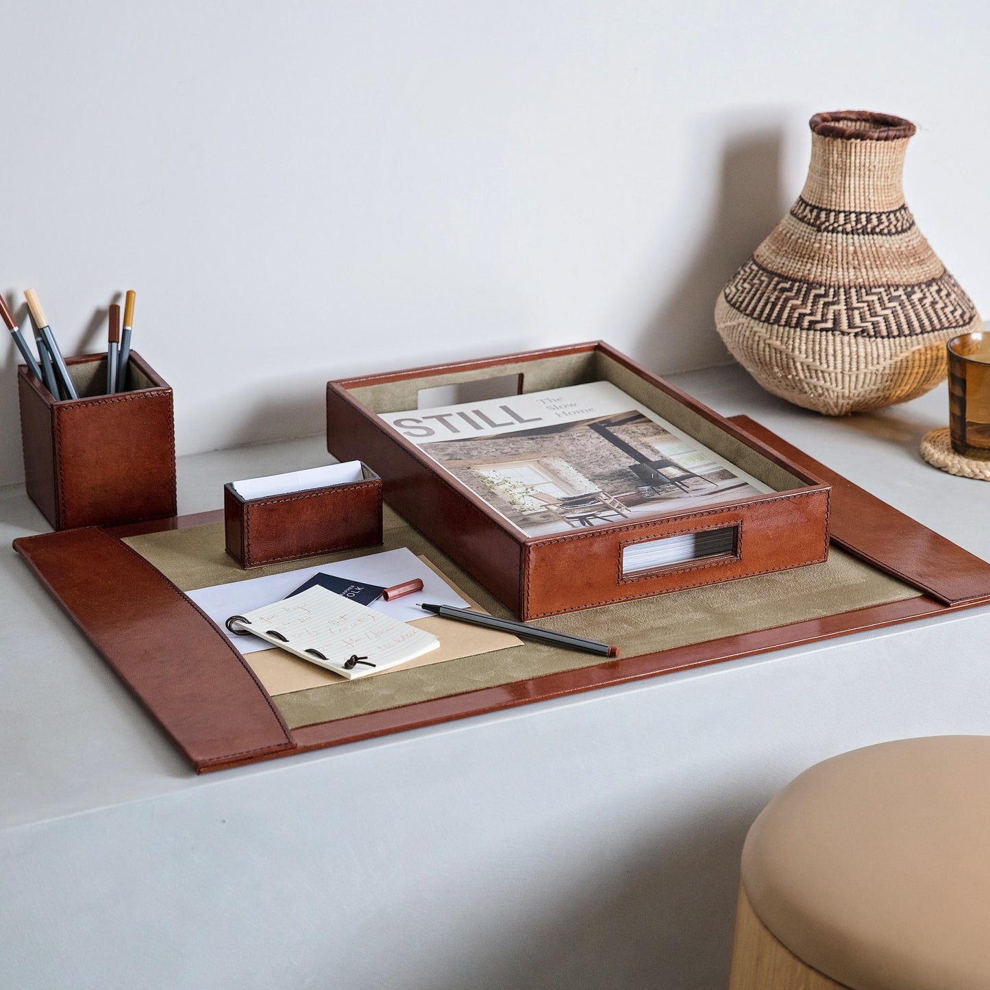 Luxury desk accessories set in tan leather, combining a desk blotter, pen pot, business card holder and A4 leather desk tray. Personalise for a thoughtful and unique gift to celebrate a new job or retirement.