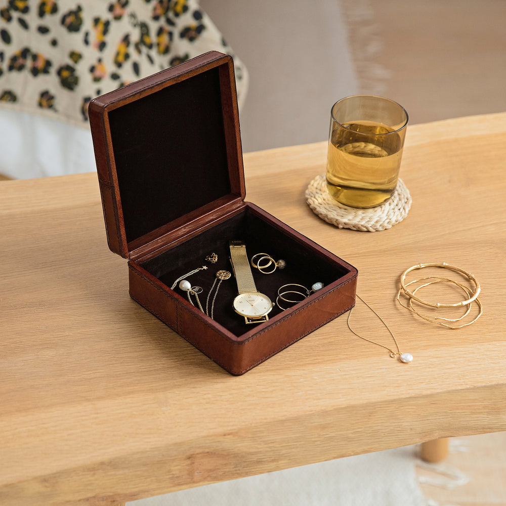 Square leather jewellery box in tan, to hold necklaces, earrings and rings. Personalise as a timeless gift for an 18th birthday or wedding anniversary.