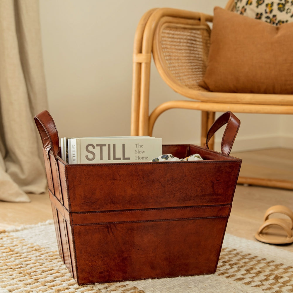 
                  
                    leather magazine basket in a tan colour
                  
                