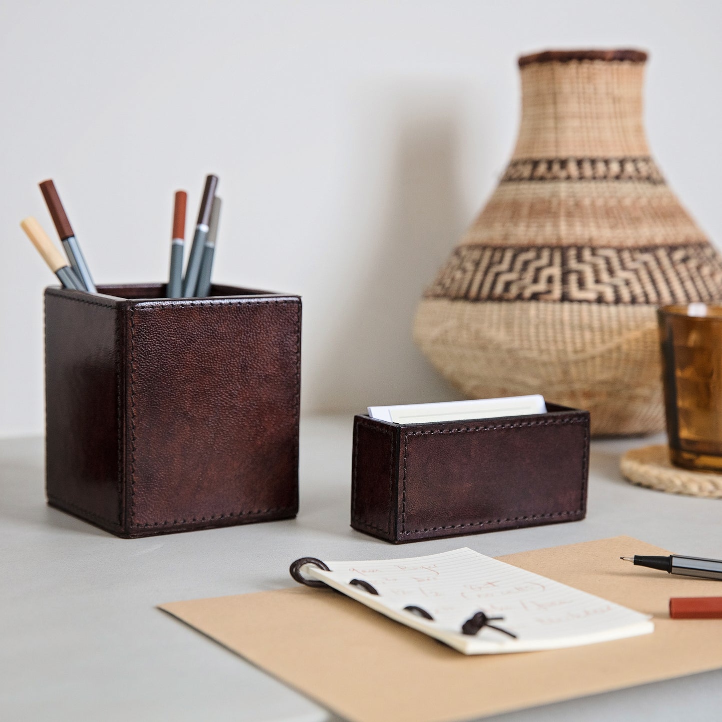 Leather pen pot and business card holder desk accessory set in brown leather. Personalise both to create a thoughtful and unique gift to celebrate a 3rd wedding anniversary or a new job.