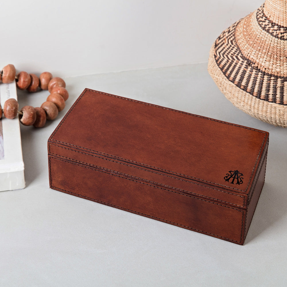 Rectangular tan leather monogram watch box with space to safely keep three watches on removeable soft pillows. Personalise with his monogrammed initials as a thoughtful third wedding anniversary gift or Father’s Day present idea.