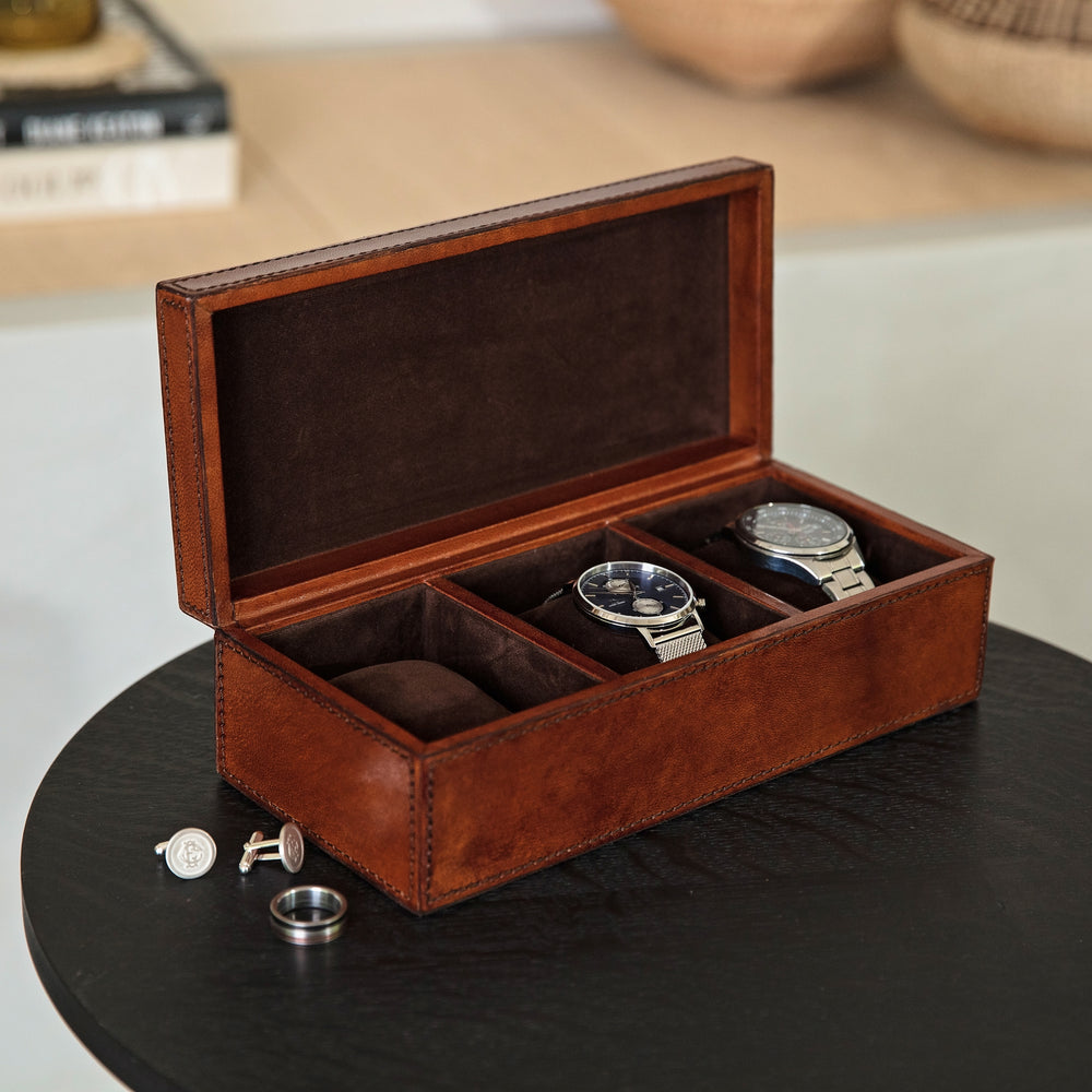 Rectangular tan leather watch box with space to safely keep three watches on removeable soft pillows. Personalise as a thoughtful third wedding anniversary gift or Father’s Day present idea.