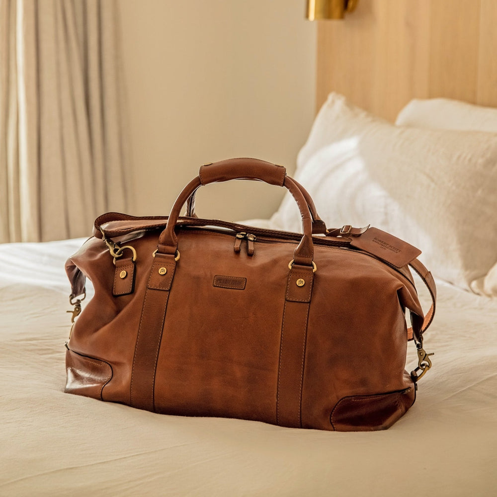 Men’s leather weekend bag made from soft tan leather. With sturdy carrying handles, removable shoulder strap, zipped inside pockets and matching luggage tag. Personalise for a thoughtful 3rd wedding anniversary gift.
