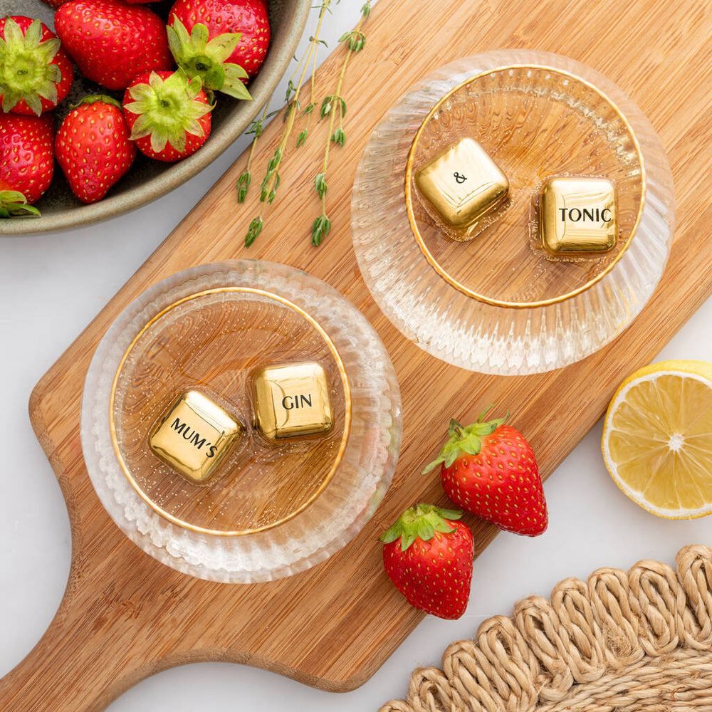 Set of four personalised gold finish stainless steel ice cubes. Add initials, names or dates to create a thoughtful Mother’s Day or Christmas gift.