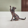 Miniature bronze figurine of a cat playfully pawing the air. A perfect bronze anniversary gift.