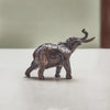 Miniature bronze figurine of an elephant. Give as a bronze anniversary gift or thoughtful birthday gift.