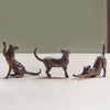 Gift set of three miniature bronze cat figurines stretching, sitting and standing. Ideal as a thoughtful birthday or bronze anniversary gift.