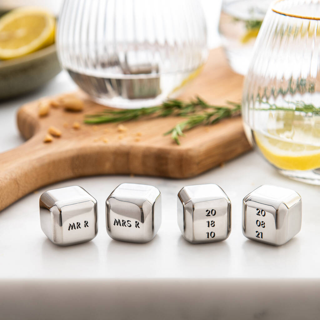 Set of four personalised stainless steel ice cubes. Add initials, names or dates to create a thoughtful gift for an 11th wedding anniversary.