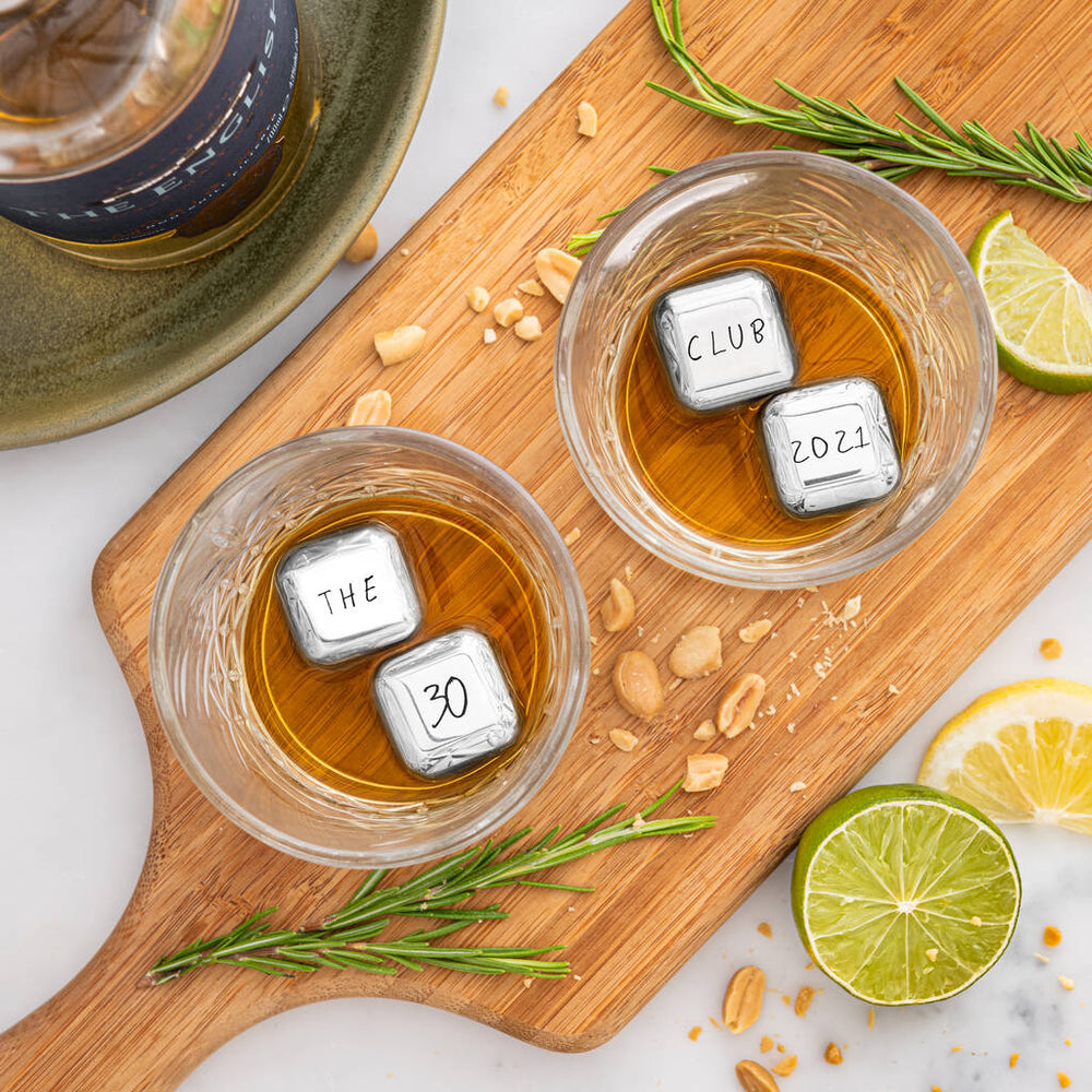 Set of four personalised stainless steel ice cubes. Add initials, names or a fun message as a unique milestone birthday gift.