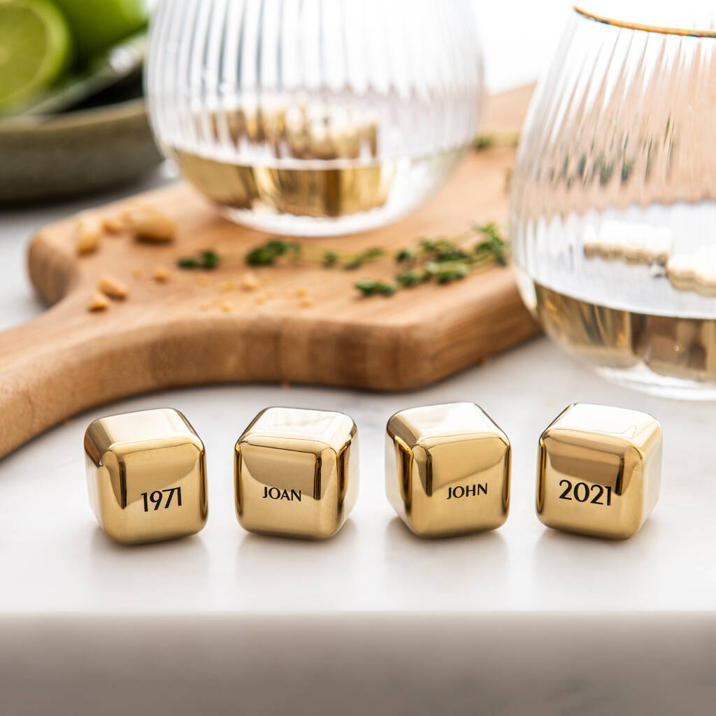 
                  
                    Set of four personalised gold finish stainless steel ice cubes. Add initials, names or dates to create a thoughtful golden wedding anniversary gift.
                  
                