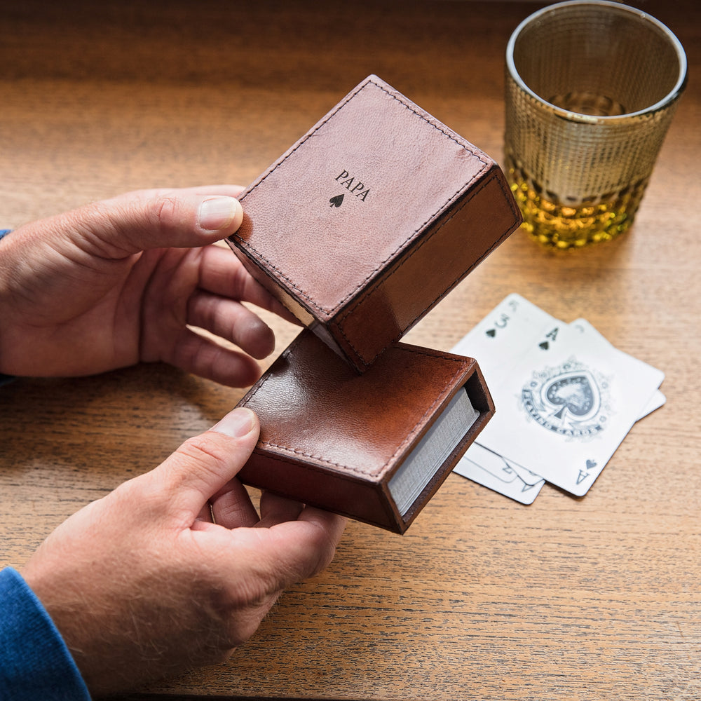 Playing card case made from soft tan leather to hold a single deck of 52 cards. Personalise with a message or name inside and out for a thoughtful birthday gift for him. 