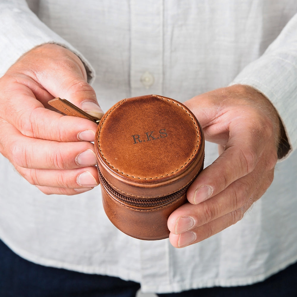 Small round travel jewellery case in soft tan leather with zip closure. Ideal for small jewellery whilst travelling. Personalise with a name, or date as a thoughtful anniversary or birthday gift.