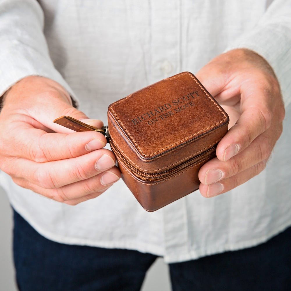 Tan leather travel jewellery box with zip closure. Ideal for small jewellery whilst travelling. Personalise with a name, or date as a thoughtful anniversary or Father’s Day gift.
